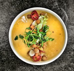 turn soup into a main meal. Butternut squash soup topped with shredded vegetables.